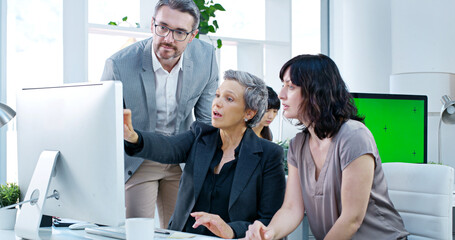Collaboration, computer and project management with business people in office together for...