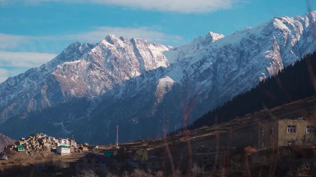 Triloknath village under the snowy Himalayan mountain peak at Lahaul and Spiti district in Himachal Pradesh, India. Beautiful village under the snowy Himalayan mountain peaks during the winter season.