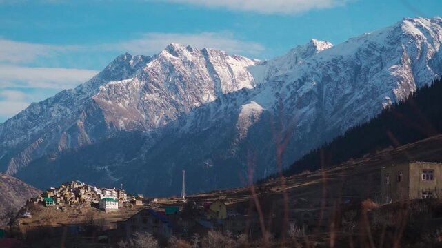 Triloknath village under the snowy Himalayan mountain peak at Lahaul and Spiti district in Himachal Pradesh, India. Beautiful village under the snowy Himalayan mountain peaks during the winter season.