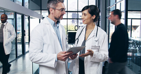 Healthcare, medical and tablet with doctors in hospital for collaboration, diagnosis or feedback....