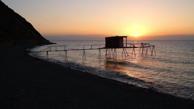 Morning at the famous fishing dives of Tekirdag province. The view of the traditional fishing harbor at sunrise. Ucmakdere beach, Marmara Sea. Turkey - 4k video 