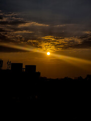 Orange light of setting sun illuminating the skyscrapers and high-rise buildings in Bangalore, India.