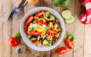 mixed vegetable salad with tuna, egg, tomato and cucumber