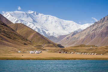 Scenic landscape view of snowcapped Lenin Peak aka Ibn Sina peak in Trans Alay mountain range with...