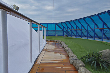 Minigolf mini golf course putting green on classic luxury cruiseship cruise ship liner for adult sport entertainment