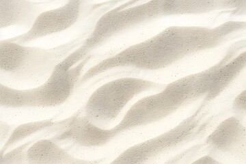 Fototapeta premium A close-up view of textured white sand, showcasing natural patterns and shadows.