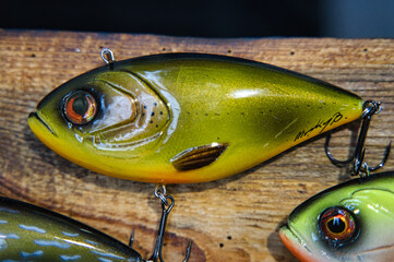 Wobblers, spinners, sheet metal, fishing lures made of wood, rubber and materials presented during...
