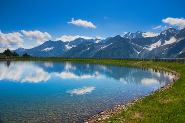 Beautiful Alpine lake and view, lovely surroundings around the lake. Lago Valbiolo, near Tonale Pass, Val di Sole, Italy