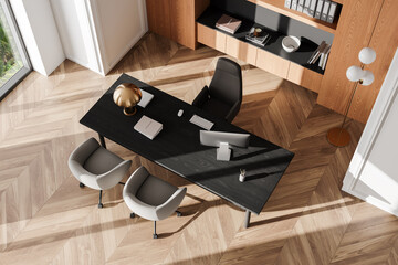 Top view of a modern office desk setup with a computer, lamp, and books on a wooden floor, accompanied by chairs and shelves in a bright room. 3D Rendering