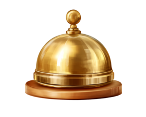 a gold bell on a wooden surface