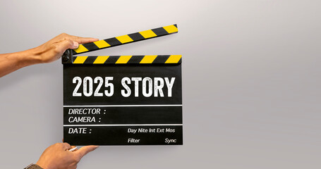 2025 story. handwriting on film slate or movie clapboard. starting to new story. Happy new year...