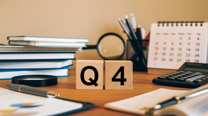 Close up image of wooden cubes with alphabet Q4 on office desk. Fourth quarter concept.