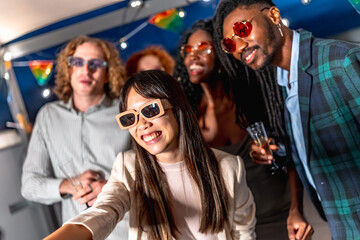 Chinese woman taking selfie while enjoying night party with friends