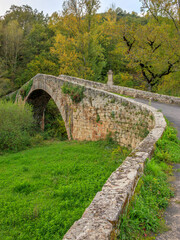 Small rustic bridge in the village of Lapeyre in Aveyron in France