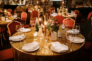 Elegant Festive Table with Golden Decor and Candles