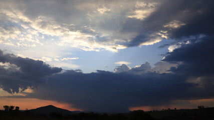 Contrast of White and Black Clouds in the Sky, Capturing the Dramatic Beauty of Nature with Bold Shadows and Light, Perfect for Representing Stormy Weather, Atmospheric Drama, or a Moody Sky