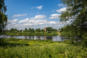 The Mologa River with a view of the Church of the Descent of the Holy Spirit (Dukhovskaya Church). Ustyuzhna. Vologda Oblast. Russia