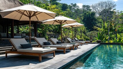Tranquil Outdoor Lounge Area with Sunbeds Beside a Refreshing Pool