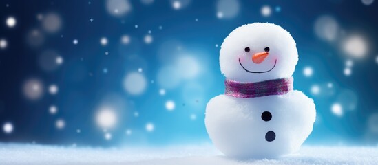 Fototapeta premium Playful marshmallow snowman on a soft blue background with blurred lights perfect for winter themed designs and festive greetings