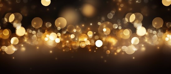 Golden bokeh lights creating a shimmering background with soft glows and blurred effects ideal for festive or elegant design projects.