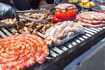 Street food with huge barbecue with many cuts of different meat of traditional Italian and Sicilian roast on grill