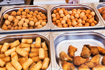 Fair stand with typical Italian street food with arancini, potato croquettes, supplì and fried chicken
