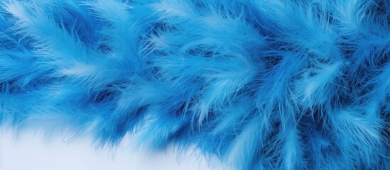 Obraz premium Blue fluffy tinsel with white tips creating a festive border for a blank Christmas card mockup in a top-down view setting