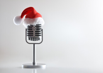 Metal retro microphone with santa hat on white isolated background