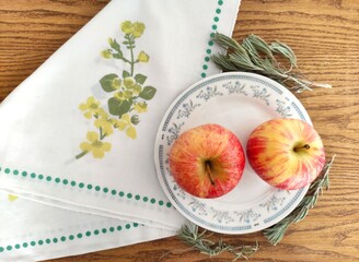 Red and green apples on the table