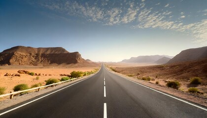 Fototapeta premium Endless Desert Adventure on an Empty Asphalt Road: A Breathtaking Journey Across Arid Landscapes, Capturing Vast Horizons and Expansive Sky Views in Remote Desert Wilderness â€“ Discover