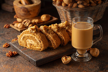 Dessert with walnuts and coffee latte on a vintage background.
