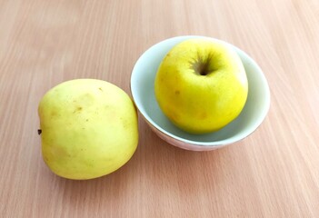 Red and green apples on the table
