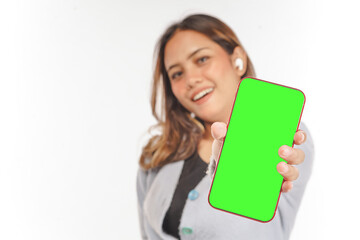 Naklejka premium young asian Woman while using airpods shows blank smartphone screen
