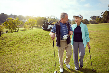 Golf, smile and walking with senior couple outdoor on course together for leisure activity. Grass, mockup space and retirement with happy old people playing sports for bonding or recreation in summer
