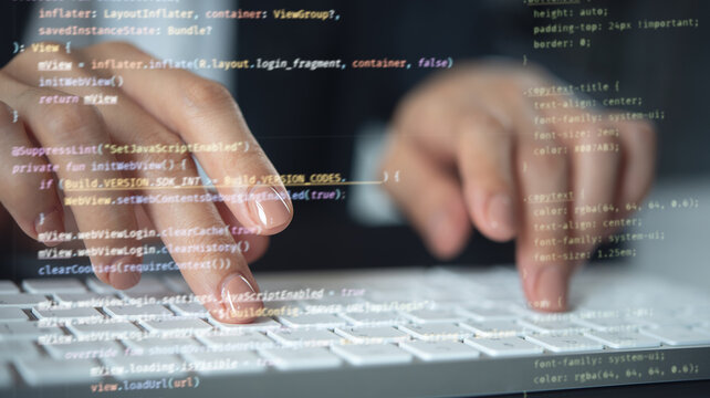 Computer programmer, software engineer typing, coding javascript on laptop computer, software development concept. Website design and coding technology