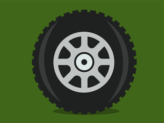 black wheel of an off-road car on a dark green background