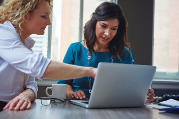 Team, laptop and business women help, problem solving and creative solution in startup. Computer, training and collaboration for project, planning or social media marketer work on campaign in meeting