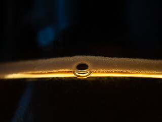 macro shot of the water droplets on a black surface