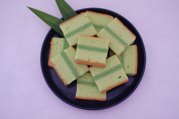 pandan cake on black plate. Selective focus.