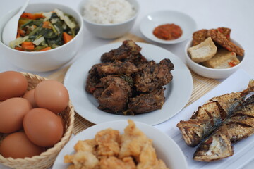 traditional Indonesian food arranged neatly on a white surface