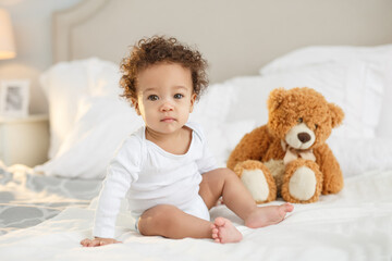Cute baby with fluffy hair. Pretty boy.