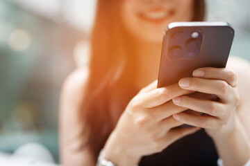 close up of young woman using mobile smart phone