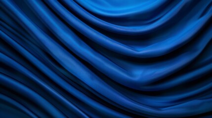 Obraz premium Smooth blue fabric draped elegantly in waves.