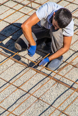 Knitting metal reinforcement for a swimming pool. Selective focus.