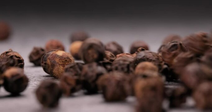 Peppercorns or black pepper spice. Super Macro Close Up.