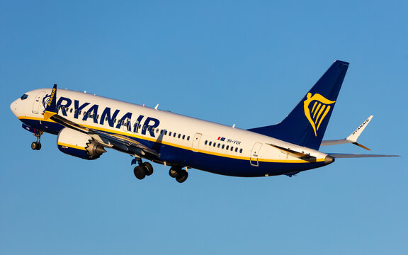 Salzburg, Austria - January 27, 2024: Aeroplane of low cost airline Ryanair departing in front of blue sky