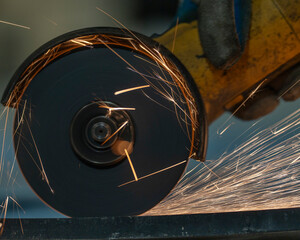 sparks of a metal with a grinder. the sparks of the metal