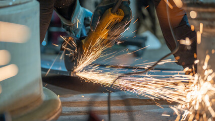 sparks of a metal with a grinder. the sparks of the metal