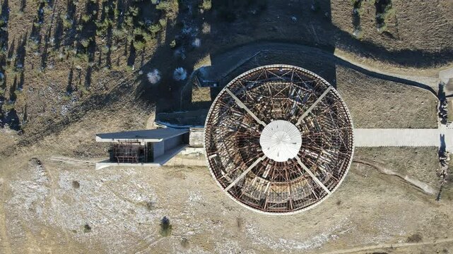 Aerial view of Ruins of Abandoned Memorial House of Bulgarian Communist Party at Buzludzha Peak, Stara Zagora region, Bulgaria
