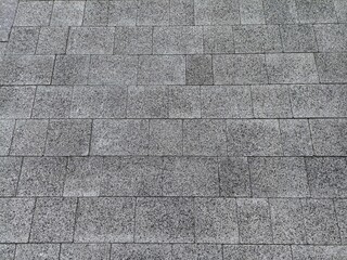 surface covered with grey rectangular tiles